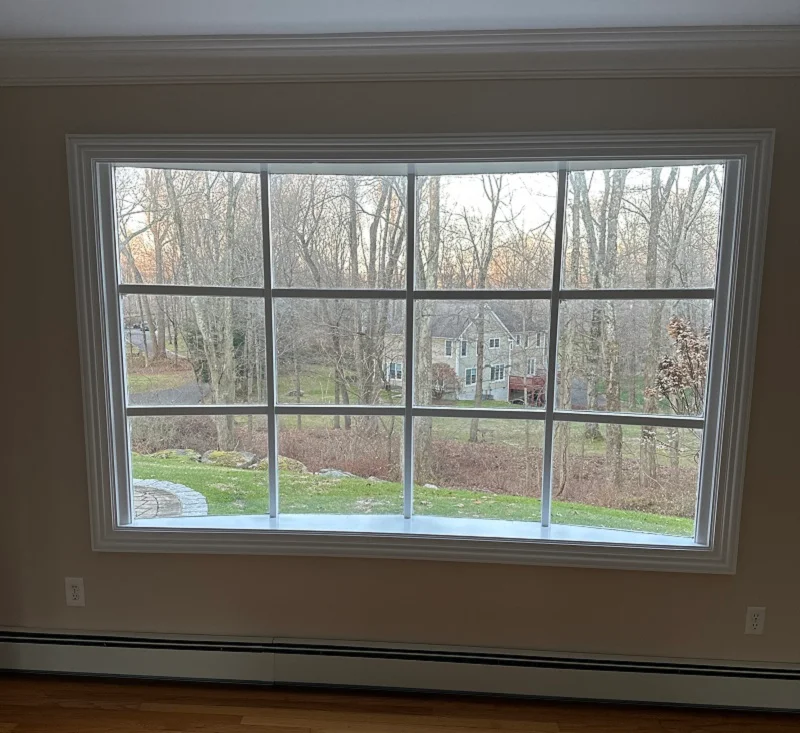 Old wood bow window in RIdgefield allows cold air insode